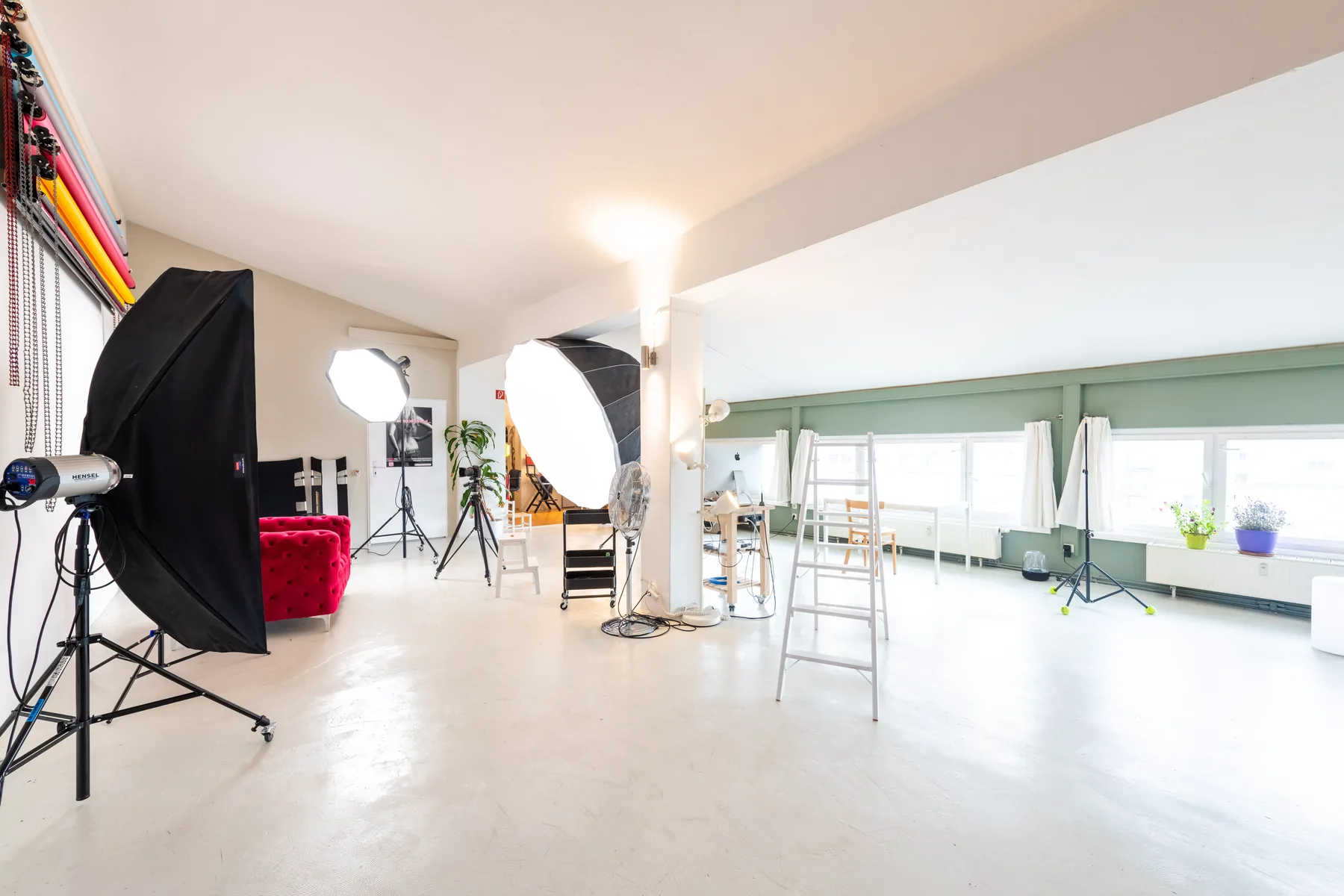 Large bright studio and event area with lighting equipment