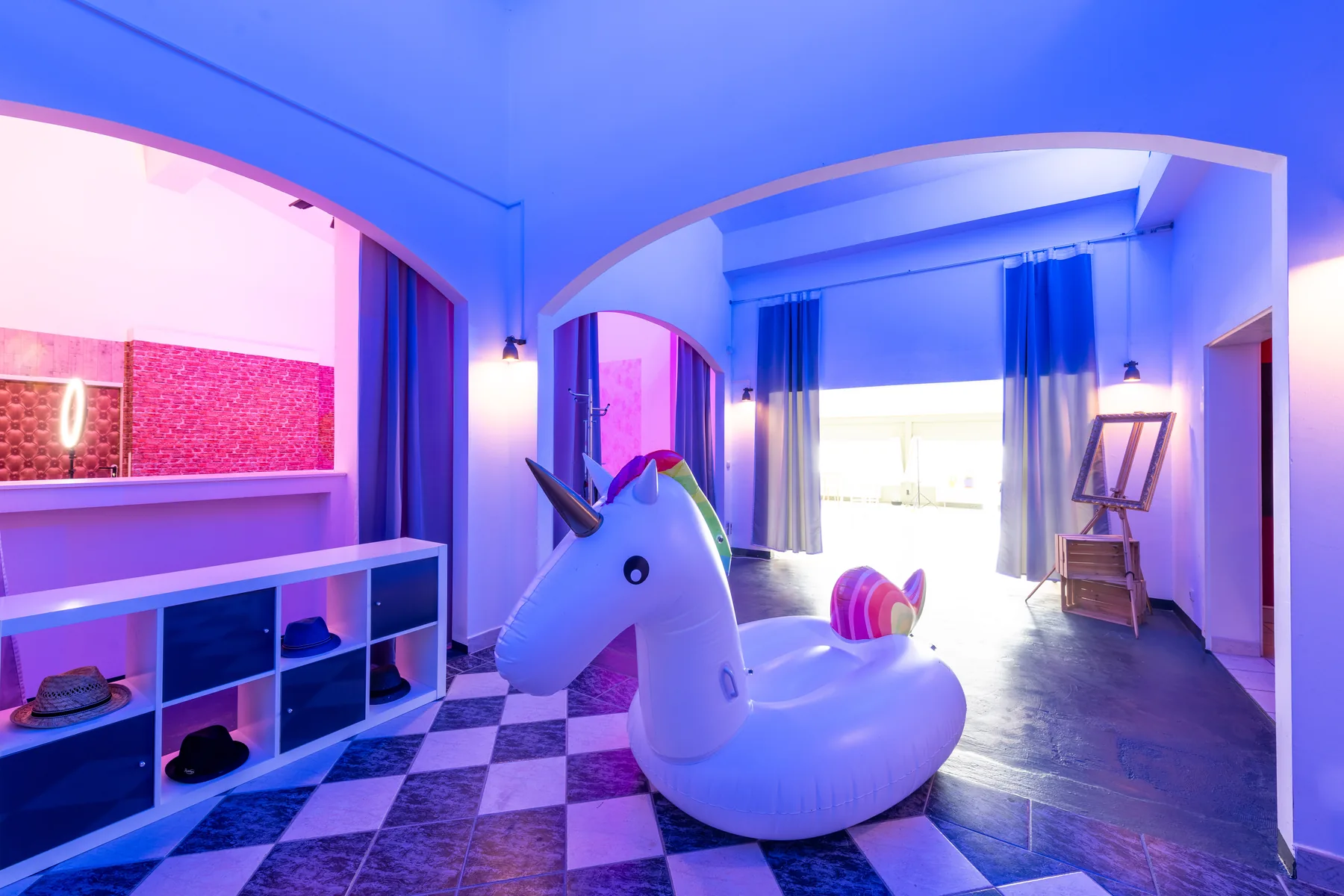 Creative set with colourful lighting and large prop