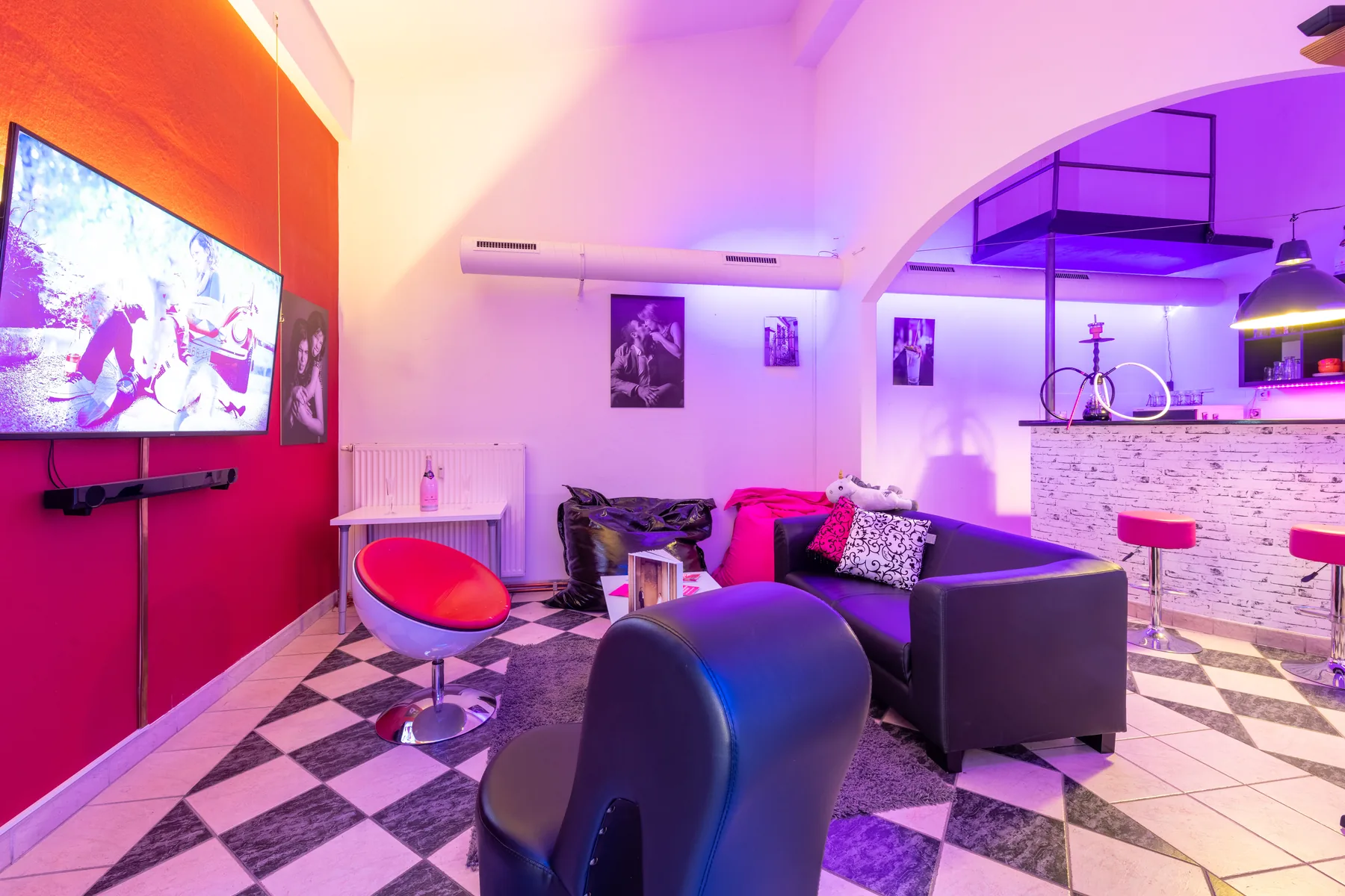 Colourful lounge set with television